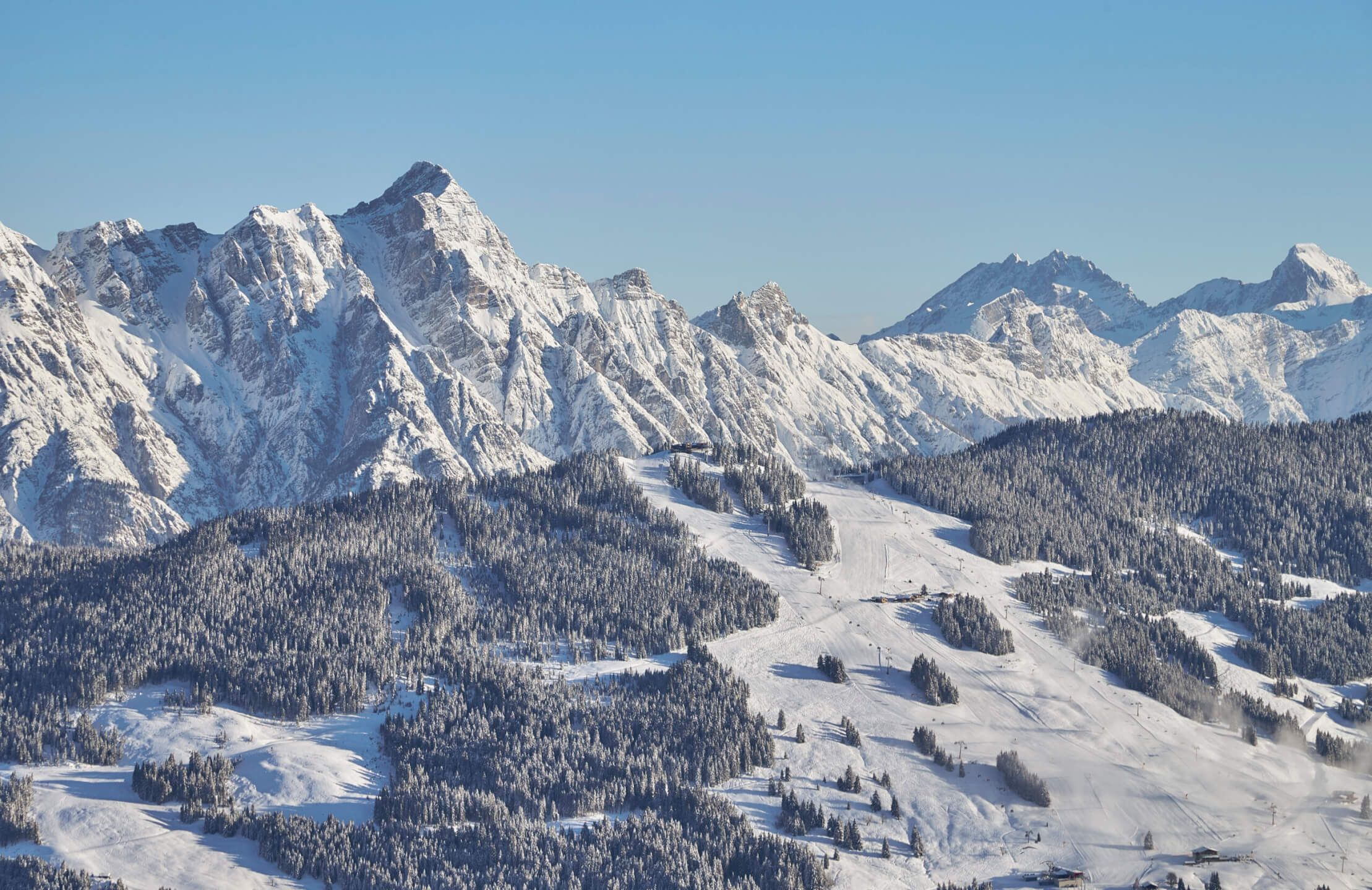 Saalbach Hinterglemm ski slopes with panoramic alpine mountain views and perfectly groomed pistes in winter
