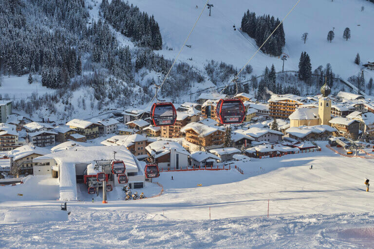Saalbach Hinterglemm ski slopes with panoramic alpine mountain views and perfectly groomed pistes in winter