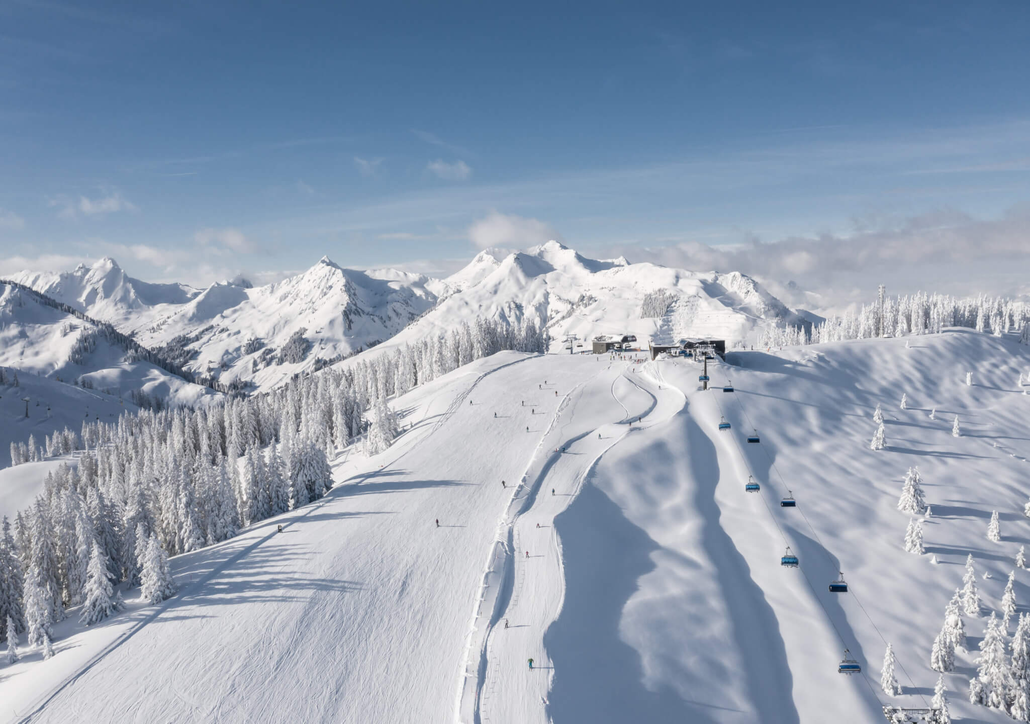 Saalbach Hinterglemm ski slopes with alpine mountain panorama in winter