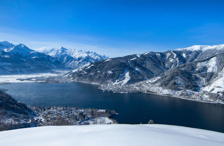 Winter view from the Mitterberg over Lake Zell and the snow-covered mountains of Zell am See-Kaprun