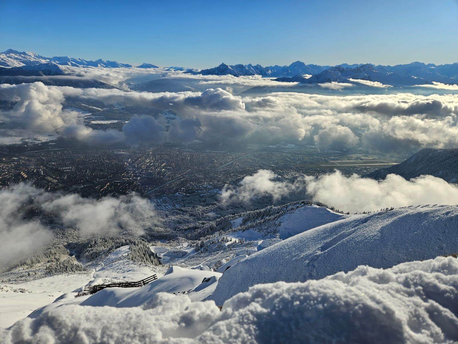 View from the Nordkette above Innsbruck and a sea of clouds