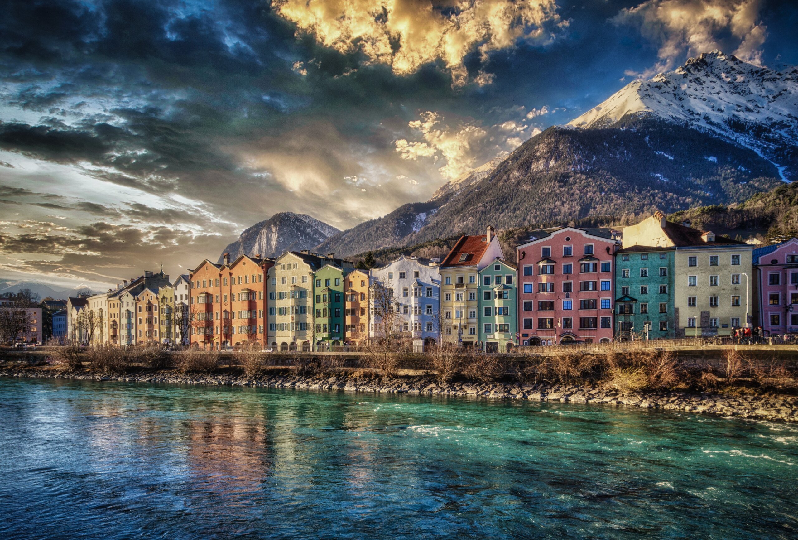 Colourful houses on the river Inn in Innsbruck with the Nordkette mountains