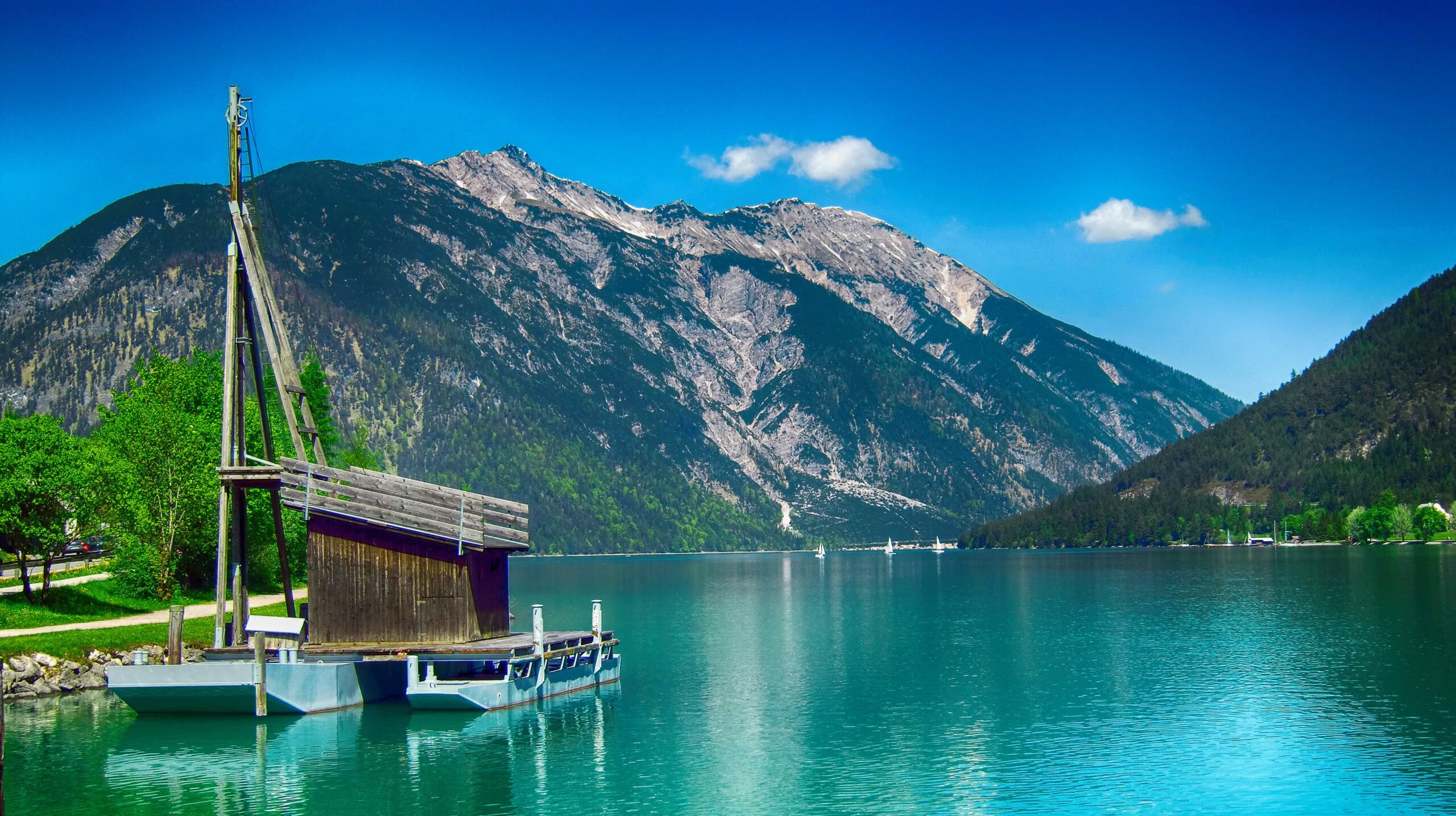 Turquoise Lake Achensee surrounded by mountains in Tirol