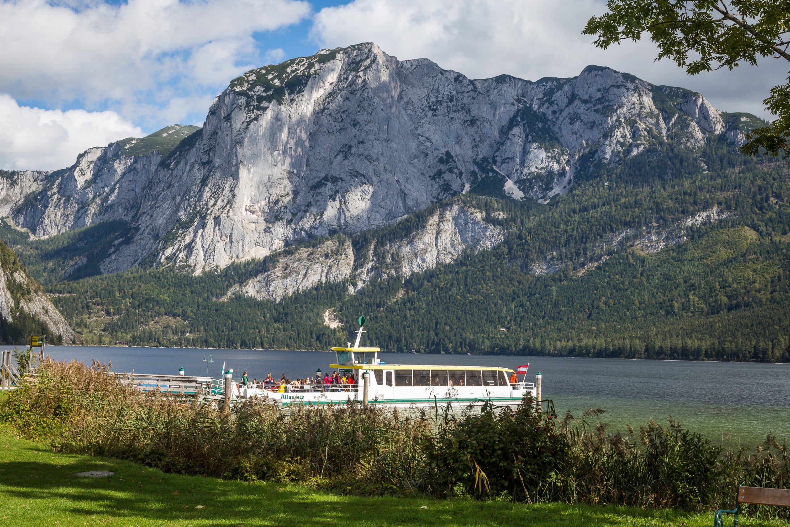 Altaussee lake with the Trisselwand and a boat, Ausseerland